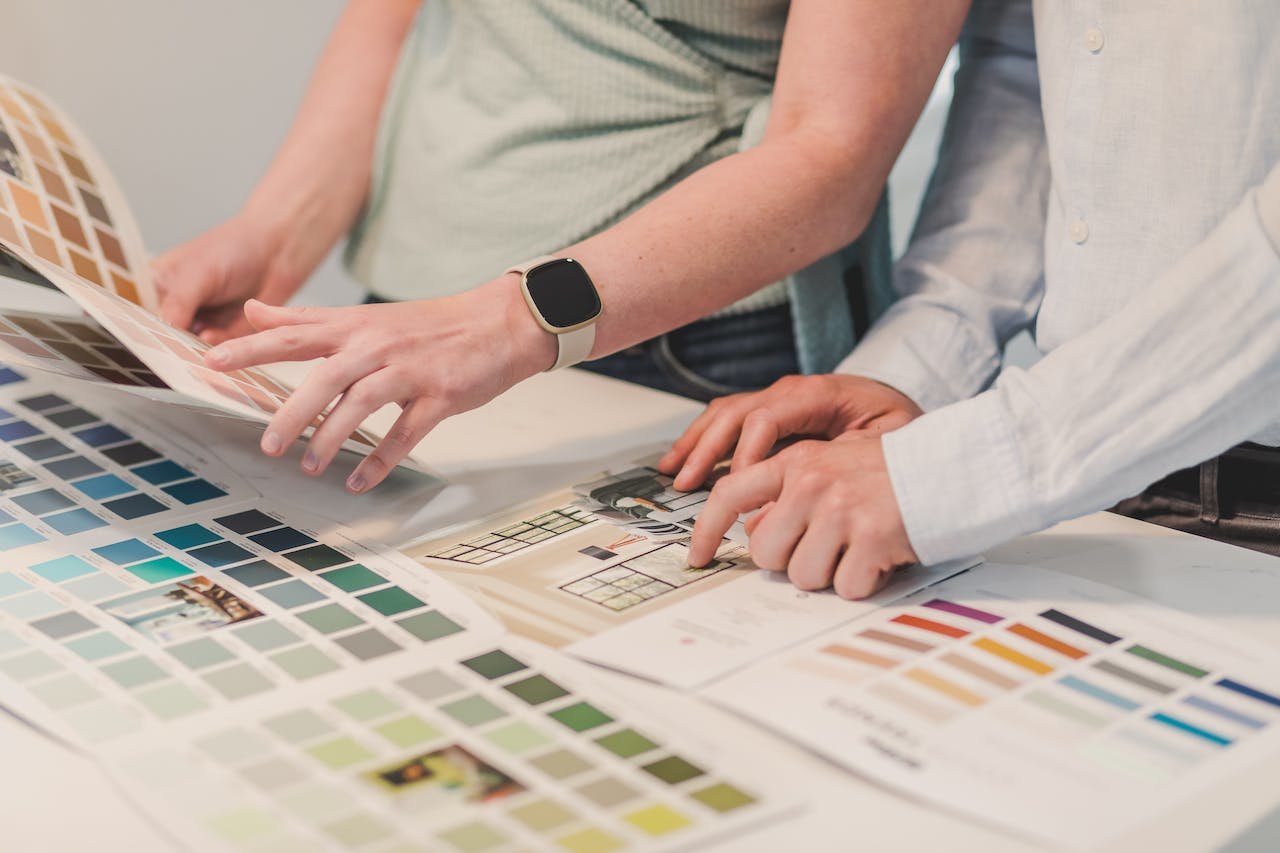 a couple choosing paint color for their home